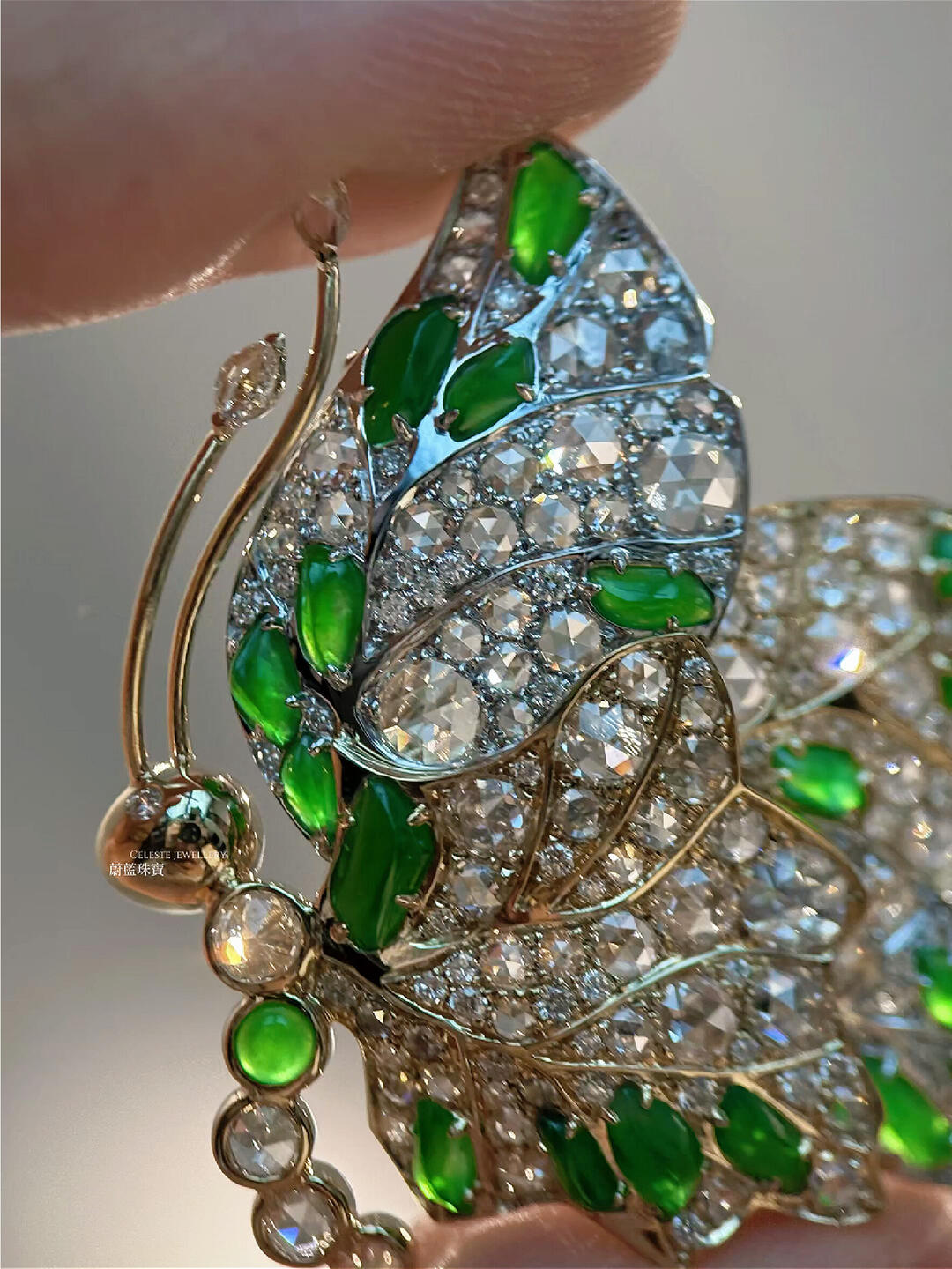 A breathing butterfly brooch